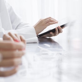 hands and tablet